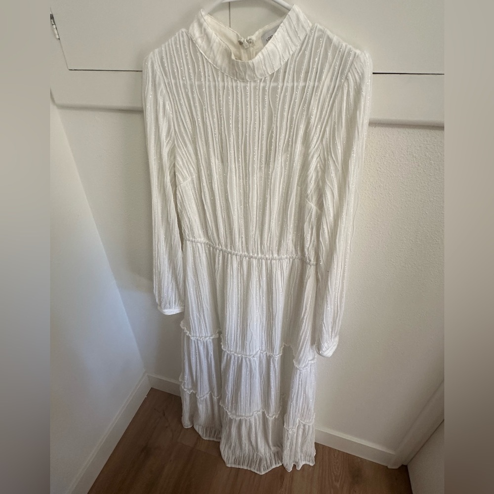 Festive and sparkly white dress.